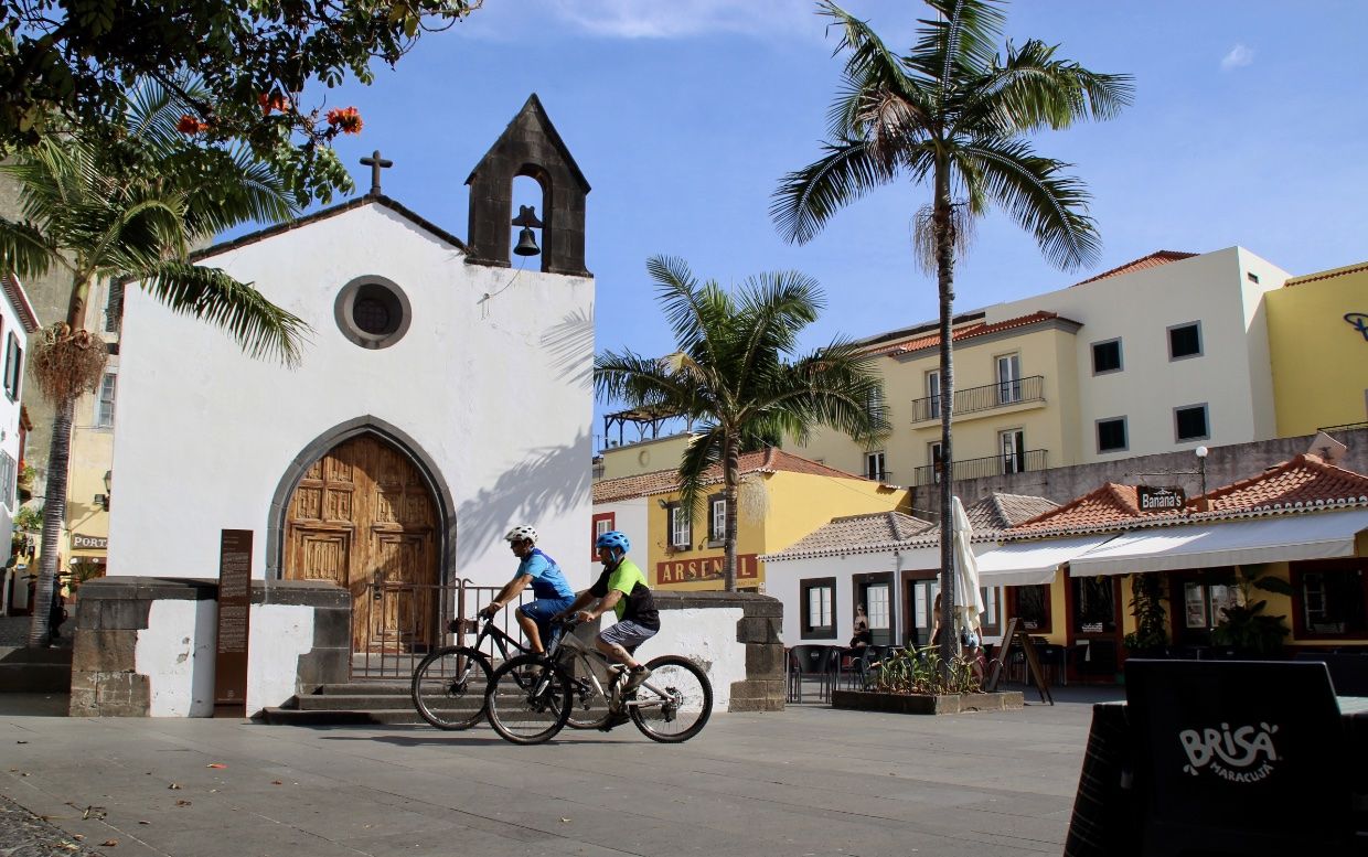Bikers in front of a small church